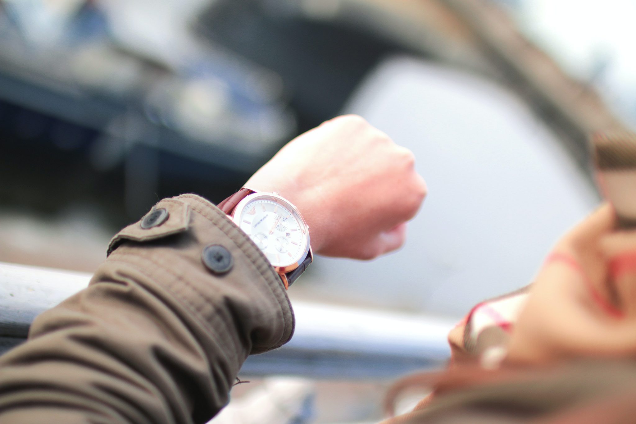 waiting to pay the bill at a restaurant. Man checking his watch because he has been waiting for so long to pay the tab at a restaurant